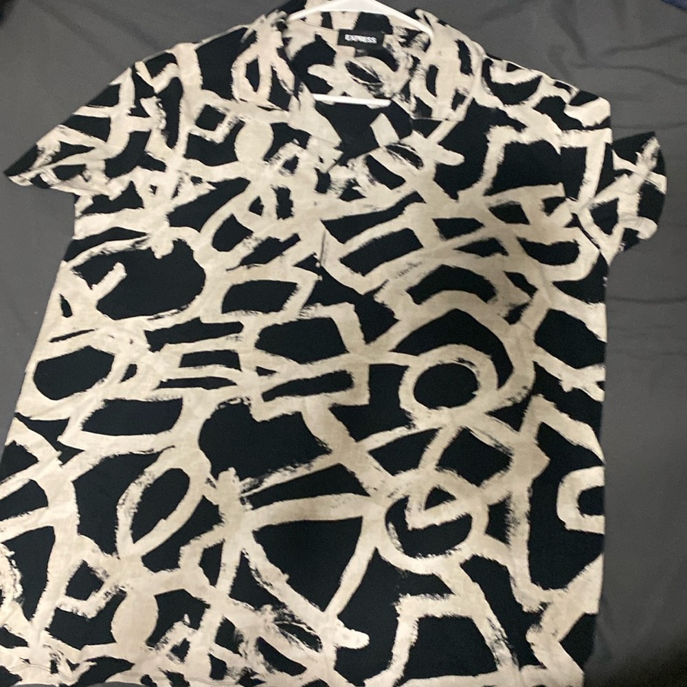 Back and white polo express shirt. Unique patters of black and white.